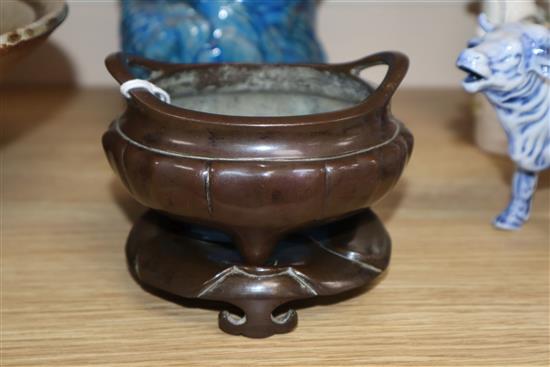 A Chinese bronze tripod censer and stand